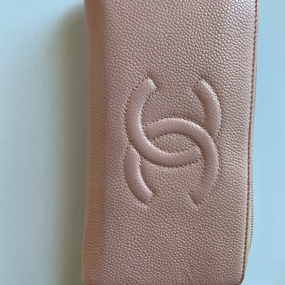 Authentic pale pink caviar Chanel zippy wallet.
